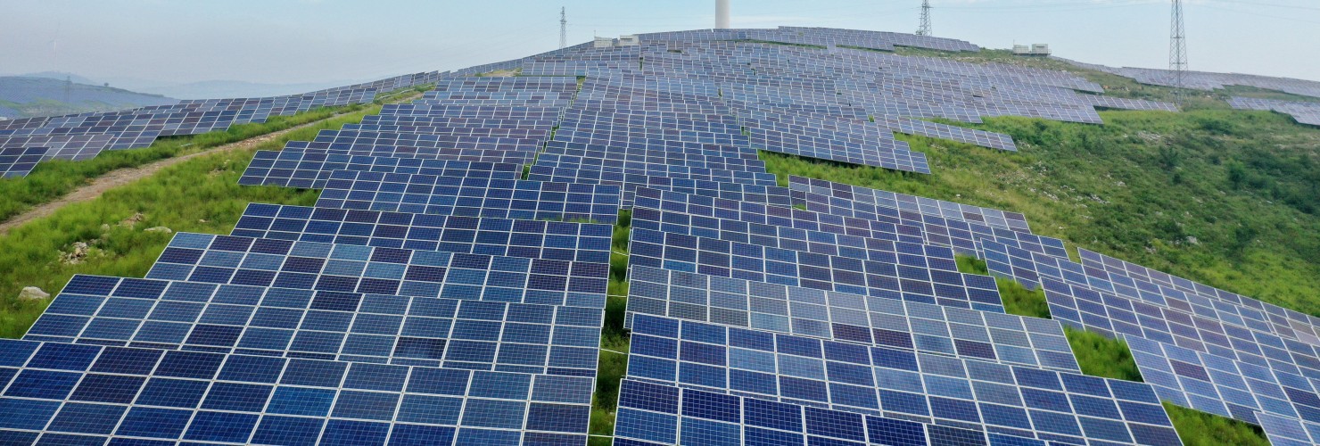 A wind-complementary power station is seen on a barren hill in Xuzhuang town, Shanting district of Zaozhuang, Shandong Province, China, Aug 26, 2022.