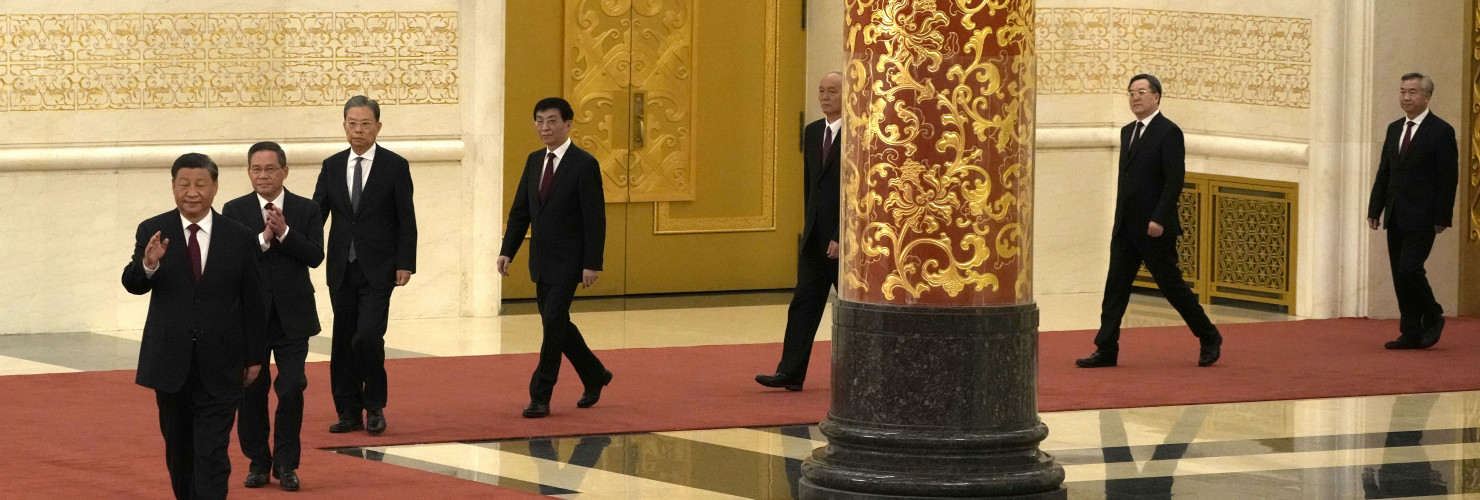 New members of the Politburo Standing Committee, from left, President Xi Jinping, Li Qiang, Zhao Leji, Wang Huning, Cai Qi, Ding Xuexiang, and Li Xi arrive at the Great Hall of the People in Beijing, Sunday, Oct. 23, 2022.