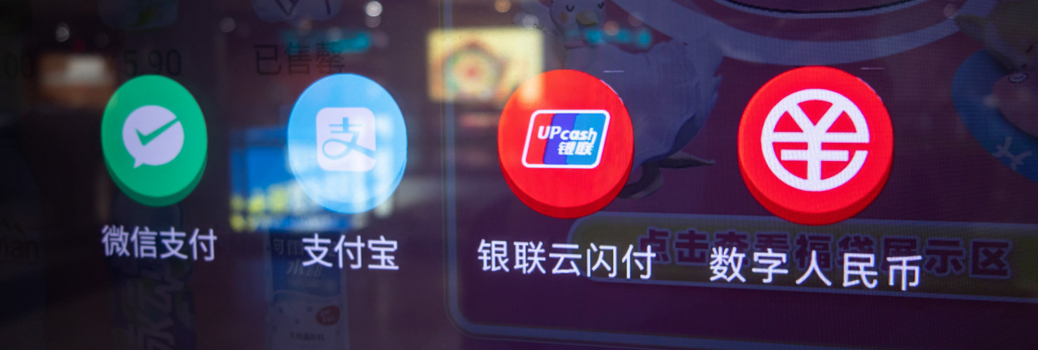 Residents buy drinks at a vending machine by scanning the code of a digital RMB wallet. at Nanjing East Road subway station in Shanghai, China, Feb. 24, 2021.