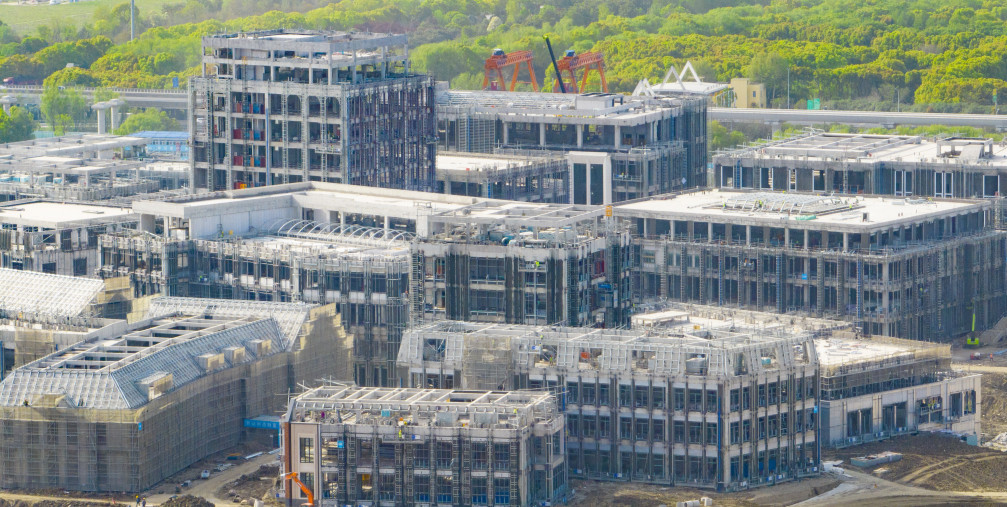 Builders, along with hundreds of engineering vehicles and ladders, push forward the construction of key projects at Huawei's Qingpu R&D Center in Shanghai, China, April 12, 2023.