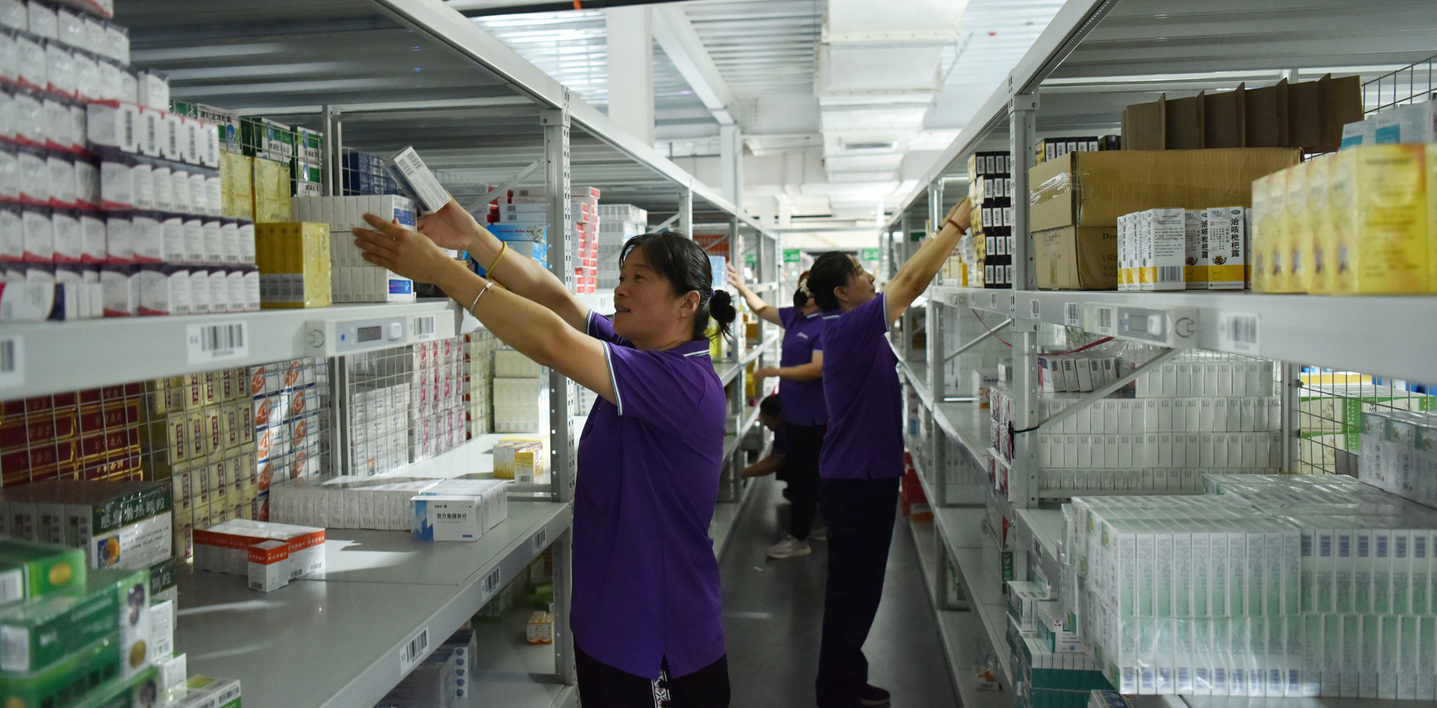 Employees sort out drugs at a pharmaceutical logistics company in Zhangjiakou, Hebei province, China