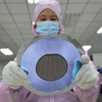 A worker produces semiconductors at a workshop of a semiconductor manufacturer in Binzhou, East China's Shandong Province, Jan 9, 2022.