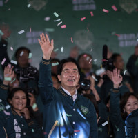 Taiwanese Vice President Lai Ching-te, also known as William Lai, left, celebrates his victory with running mate Bi-khim Hsiao in Taipei, Taiwan, Saturday, Jan. 13, 2024. 