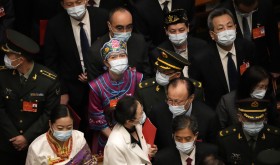 Delegates leave after the closing session of China's National People's Congress (NPC)