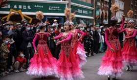 Uyghur dancers perform in Urumqi during a government organized trip for foreign journalists