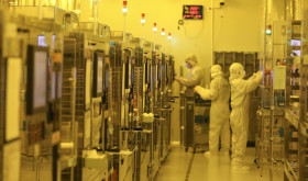 Workers process chips at a workshop of an optoelectronic technology company in Huai 'an city, Jiangsu province, May 11, 2024.